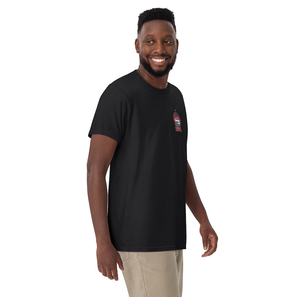 Man wearing a black t-shirt with a logo on a white background