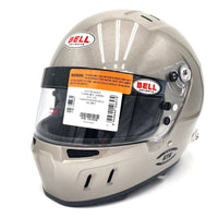 Thumbnail for Close-up of Bell GT6 RD 4C/EC helmet in titanium finish with barcode label and SNELL/FIA certifications