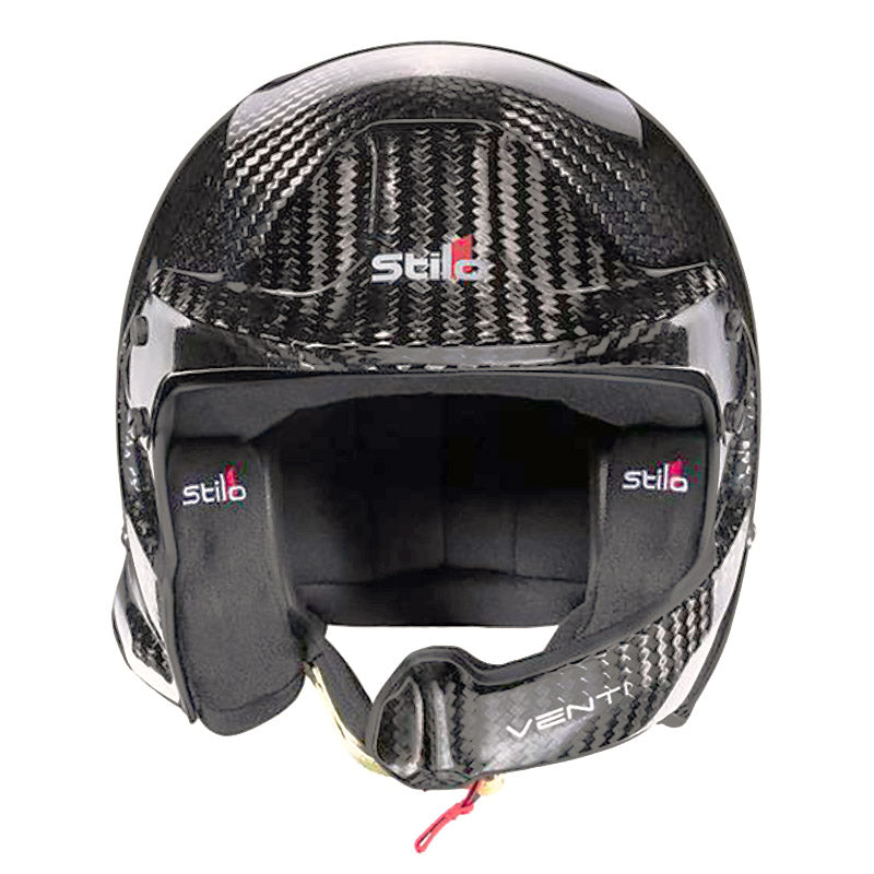 A dynamic shot of the Stilo Venti WRC Carbon Fiber 8860-2018 helmet, highlighting its aerodynamic shape and carbon fiber construction, perfect for professional motorsport.